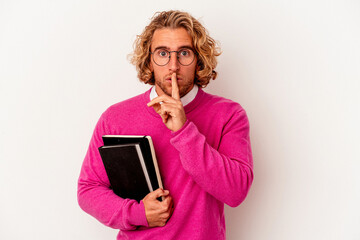 Young student caucasian man isolated on white background keeping a secret or asking for silence.