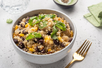 Vegan meal of quinoa with corn and black beans. Healthy organic vegan food