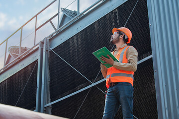 Engineer under checking the industry cooling tower air conditioner is water cooling tower air...
