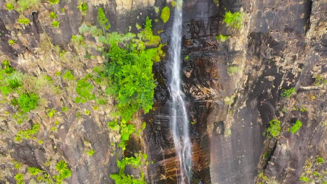 Waterfall in a tropical forest. Aerial view of Bambarakanda Falls. Sri Lanka.