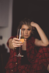 Portrait of adult hangover woman, drinking vine in depression, lonely in kitchen.Despair of thought, sadness.Alcoholism