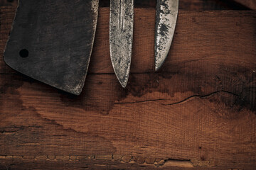 closeup of the tips of knives and a cleaver