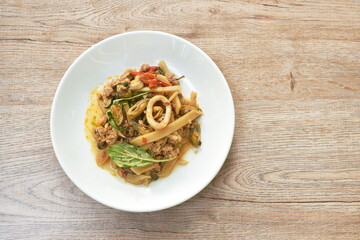 spicy stir fried bamboo shoot with mussel and squid couple mashed pork on plate