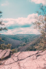 cliff mountains sky clouds Harz Germany