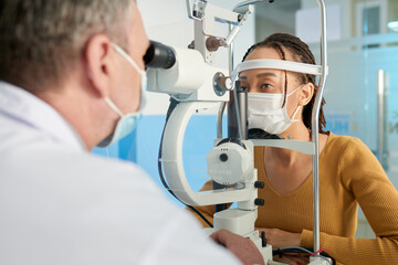 Woman getting her intraocular pressure measured during annual checkup