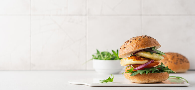 Halloumi Burger With Tomato, Arugula And Red Onion. Sandwich With Halloumi Cheese And Vegetables, Mediterranean Cuisine