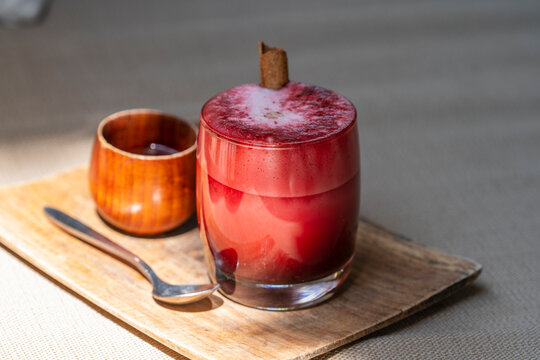 Glass of beetroot vanilla latte from fresh beetroot juice blended with vanilla and coconut milk
