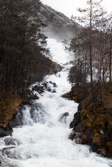 waterfall in the forest mointain Rullestad Norway