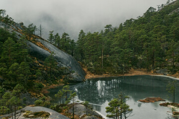 lake in the foggy mountains Norway