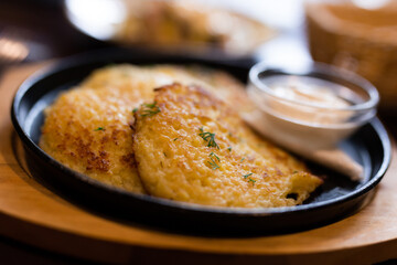 Belarusian cuisine. Potato draniki stew with sour cream