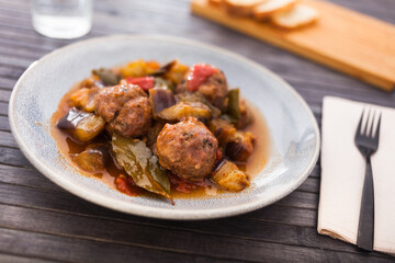 steamed meatballs with stewed vegetables on plate