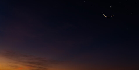 Crescent moon on dusk twilight sky in the evening symbol of religion Islamic and well use text...