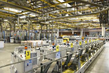 modern machines for transportation in a large print shop for production of newspapers & magazines