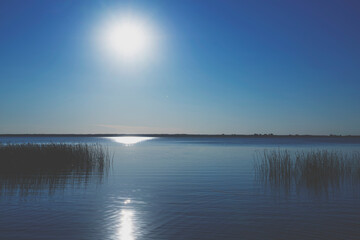 Beautiful panorama of dramatic sunset over the sea. Horizontal image.