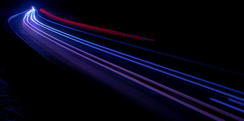 Night road lights. Lights of moving cars at night. long exposure red, blue, green, orange.