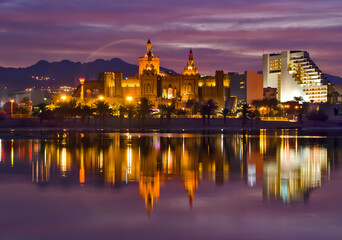 Fototapeta na wymiar Eilat tourist resort city by the night or after sunset, colorful reflections in the water