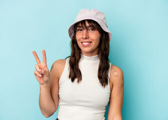 Fototapeta premium Young Argentinian woman isolated on blue background showing number two with fingers.