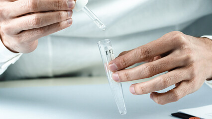 doctor applies reagent to covid 19 buffer. Omicron variant