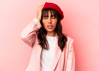 Naklejka premium Young Argentinian woman isolated on pink background tired and very sleepy keeping hand on head.