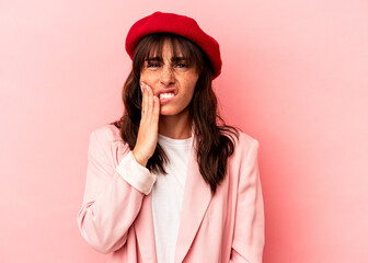 Young Argentinian woman isolated on pink background having a strong teeth pain, molar ache.