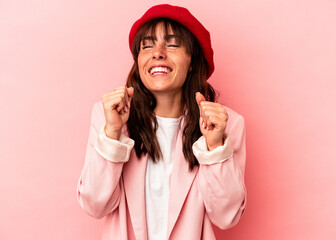 Young Argentinian woman isolated on pink background celebrating a victory, passion and enthusiasm,...
