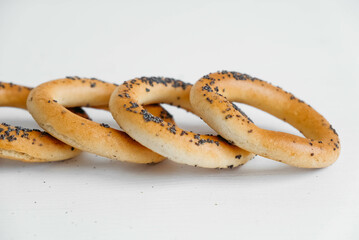 Dried bagels with poppy seeds on a white background