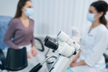 Patient seated before gynecologist during medical consultation