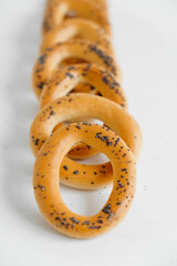 Dried bagels with poppy seeds on a white background