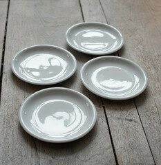 Vintage porcelain plates on a wooden table