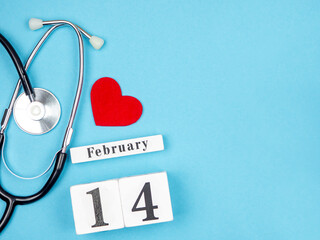 Stetscope, a red heart and a calendar on a blue background. Valentine's Day 