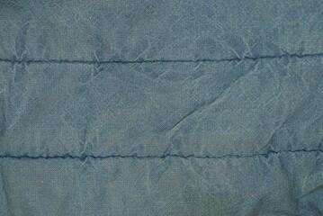 gray dark cloth background from old crumpled fabric with seams