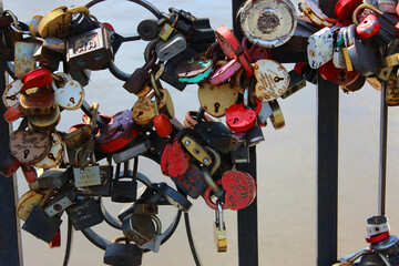 Locks of love, Valentine's Day or wedding day. Locks with a  on the decorative fence of the pond...