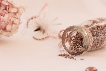 dried lavender herbs in glass jar, butterfly, dried Hortensia on white background. Copy space