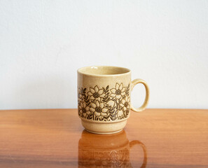 Mid-century modern ceramic mug with flower pattern