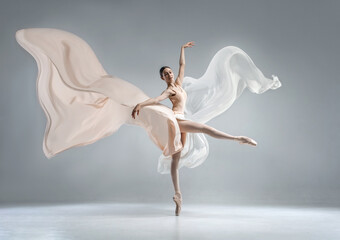 Beautiful ballerina dancing in the body color ballet leotard with body color cloth. She danced on...