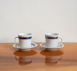 Vintage porcelain coffee cup set for two isolated