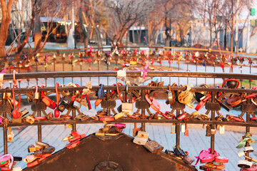 Locks of love, Valentine's Day or wedding day. Locks with a lock of love on the bridge, locks (symbols of love for love. new romantic attraction on the boardwalk Novosibirsk, Russia, August 25, 2021