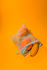 Fruits in a disposable bag on a yellow background. High quality photo