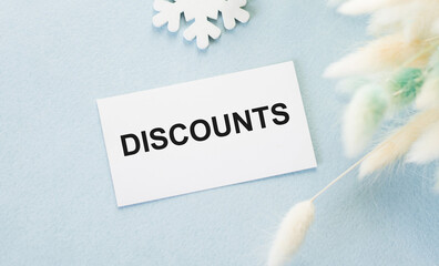 Discounts text on the card on a blue background, shopping, shopping