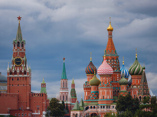 Fototapeta premium Beautiful view of Red Square with Moscow Kremlin and St. Basil's Cathedral in rainy summer. This is main tourist destination in Moscow. Beautiful panorama of heart of city.