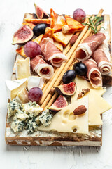 cheese platter, snacks and wine, Restaurant menu, dieting, cookbook recipe. vertical image. top view. place for text