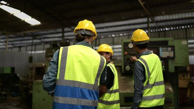 The foreign chief engineers teach and advise Asian technicians. About repairing old machinery to return to normal use