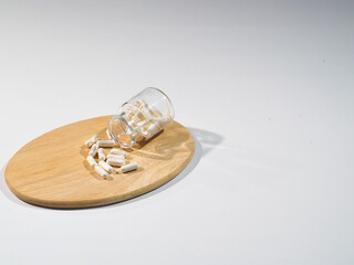 Pharmacy bottle with white pills