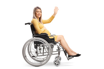Obraz na płótnie Canvas Full length profile shot of a pregnant woman sitting in a wheelchair and waving