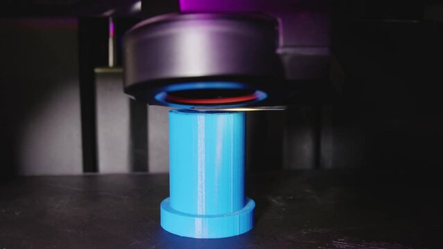 Modern 3d Printer printing a blue object