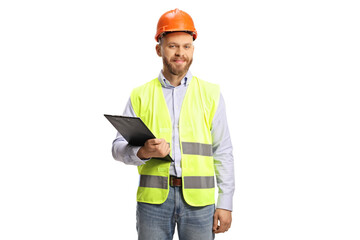 Young male engineer with a hardhat holding a clipboard