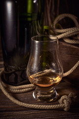 Glencairn whisky glass on a wooden background