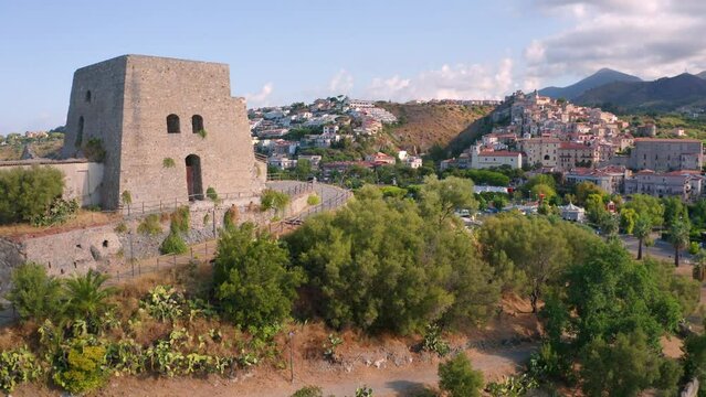 4k drone flight up footage (Ultra High Definition) of historical place - Talao Tower. Colorful morning cityscape of Scalea town, Province of Cosenza, Italy. Traveling concept background..