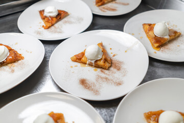 Piece of apple pie served with ice cream, close up view
