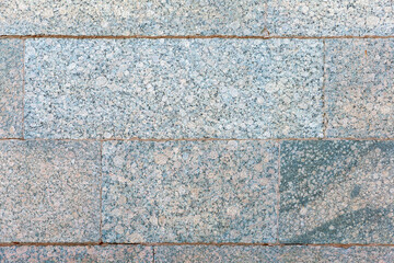 Granite brown wall of blocks. Background or texture